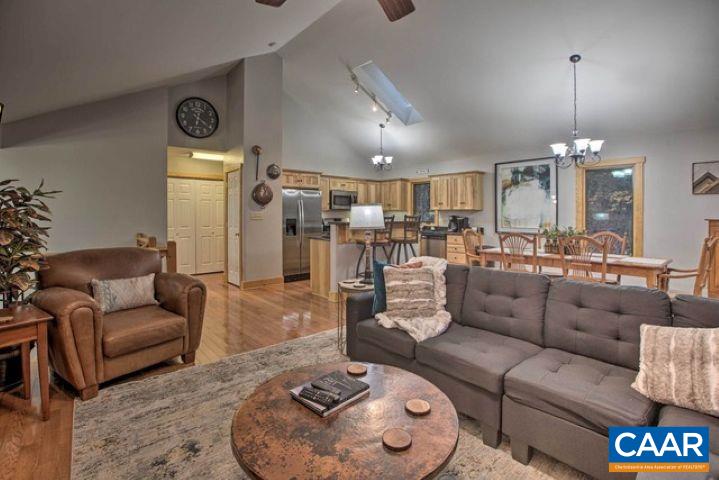 280 Fawn Ridge Drive Wintergreen, VA 22967 - Photo 5 of 23 a living room with furniture and a chandelier