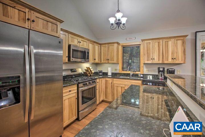 280 Fawn Ridge Drive Wintergreen, VA 22967 - Photo 9 of 23 a large kitchen with a stove a sink and a refrigerator