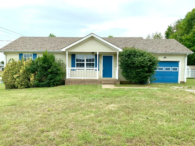 front view of a house with a yard