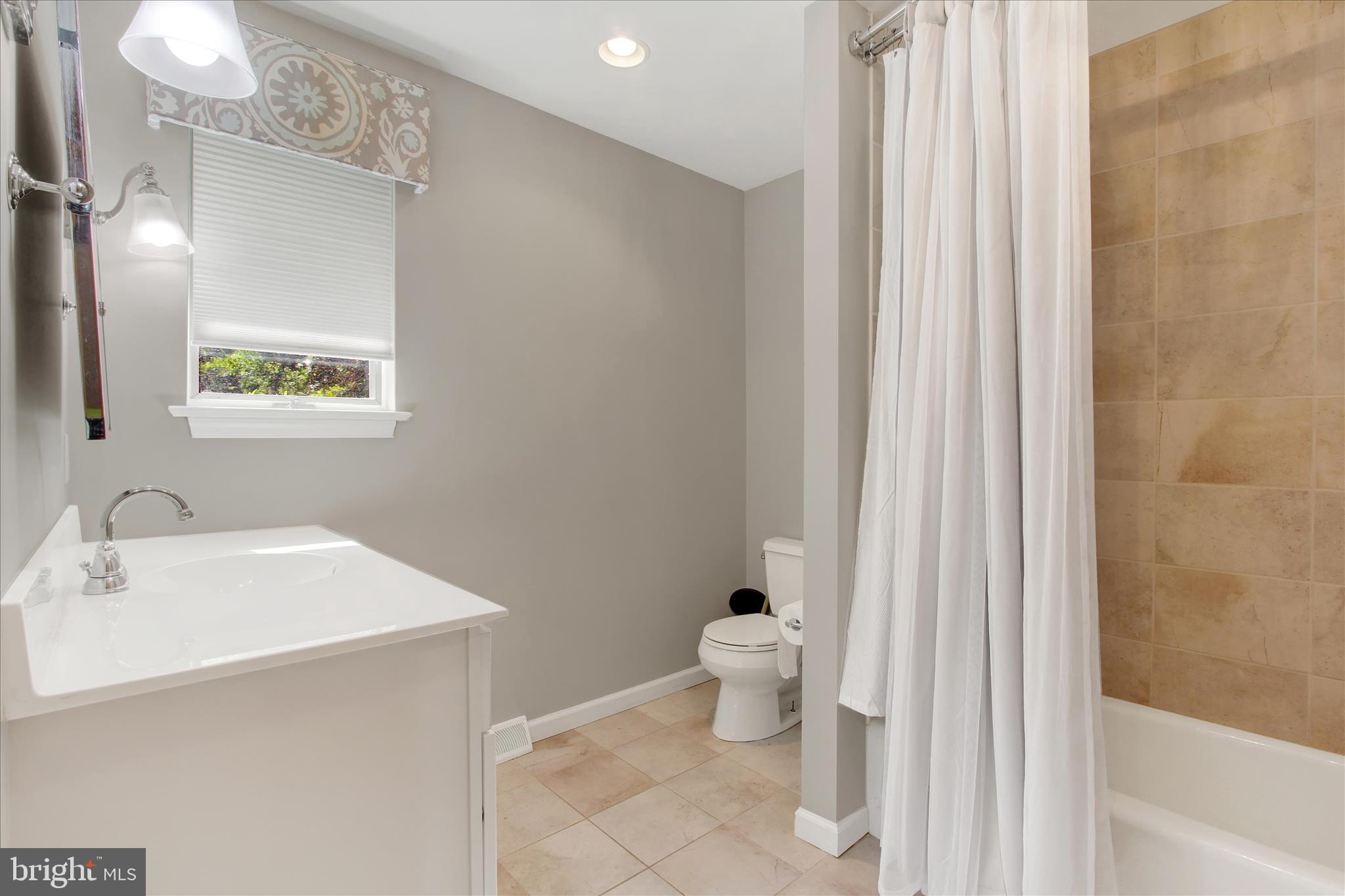 1855 Westwood Road York, PA 17403 - Photo 37 of 60 a bathroom with a sink and a mirror