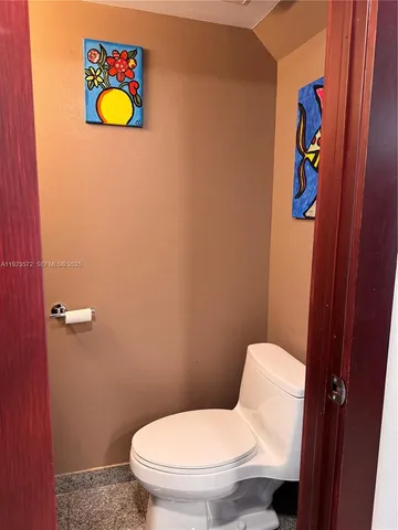 a bathroom with a toilet and sink