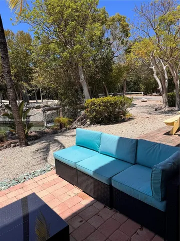 a view of a yard with a bench