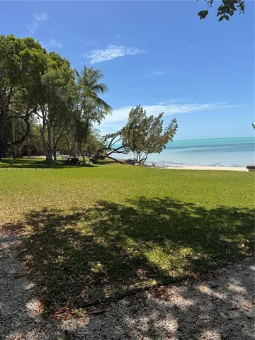 a view of an ocean and a mountain