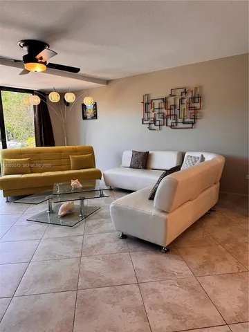 a living room with furniture and white walls