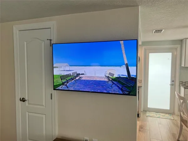 a view of a room with wooden floor and closet