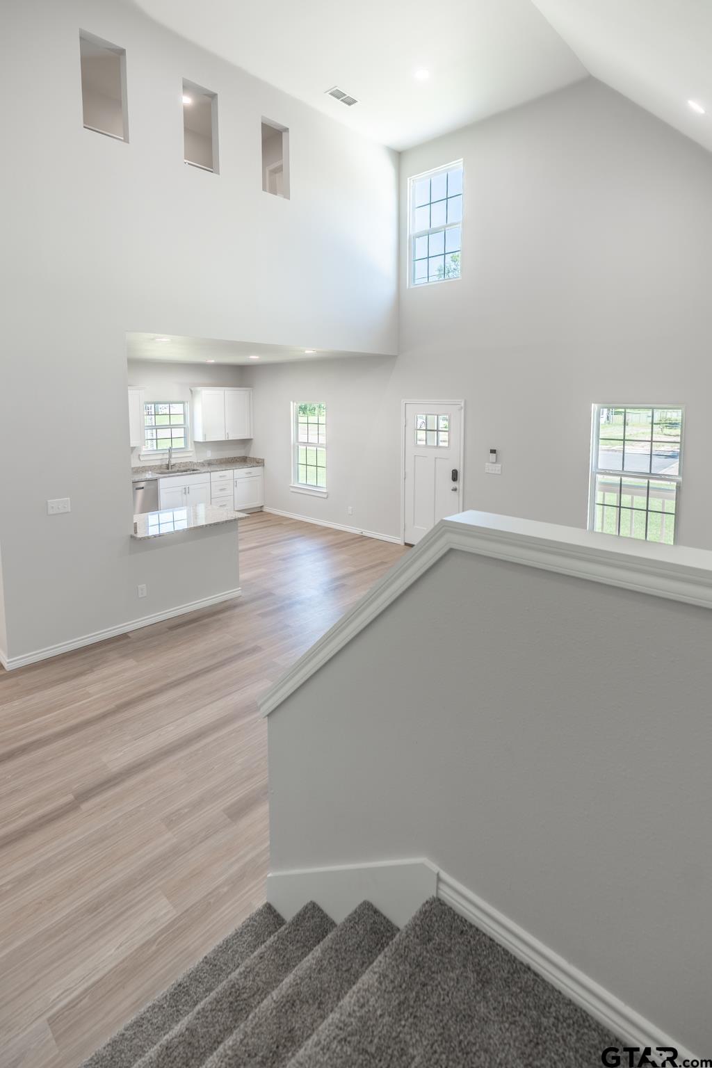 233 Harrison Street Longview, TX 75601 - Photo 8 of 44 an empty room with windows and closet