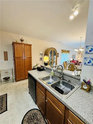 a kitchen with a sink and a refrigerator