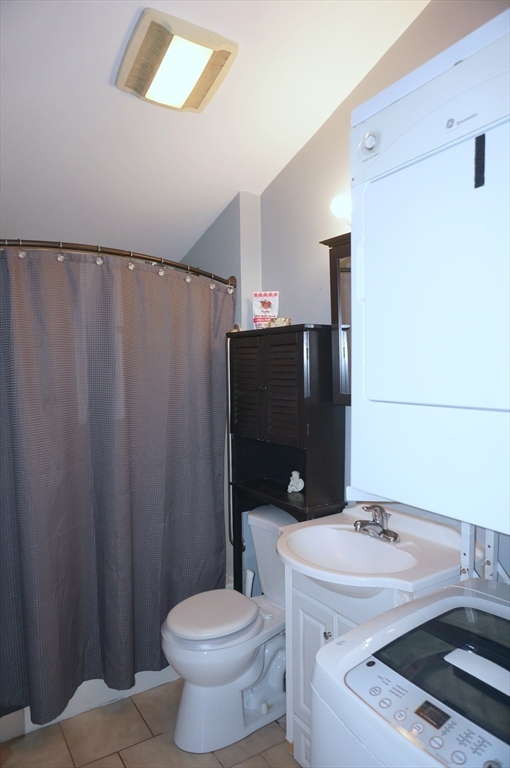 9 Circuit Road West Yarmouth, MA 02673 - Photo 11 of 23 a bathroom with a sink toilet and shower