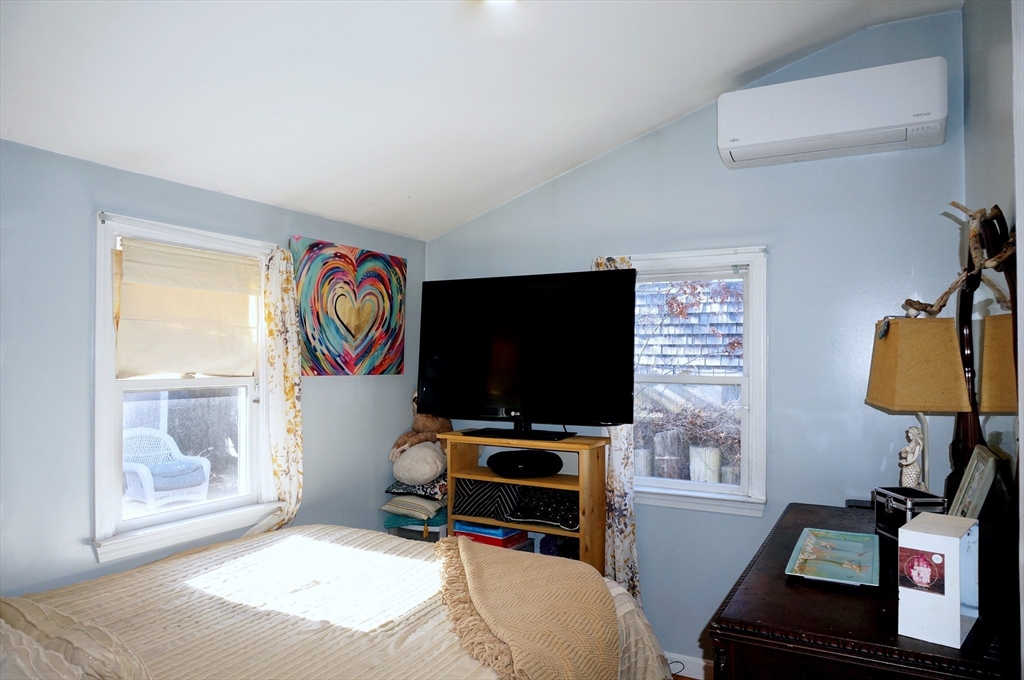 9 Circuit Road West Yarmouth, MA 02673 - Photo 12 of 23 a bedroom with furniture and a flat screen tv