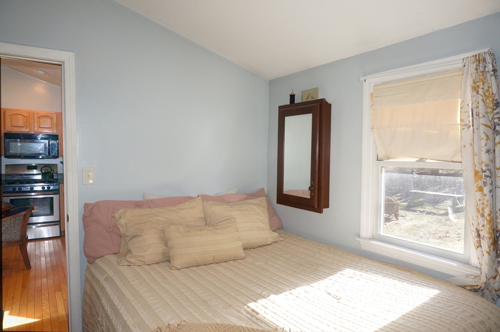 9 Circuit Road West Yarmouth, MA 02673 - Photo 14 of 23 a bedroom with a bed and a window