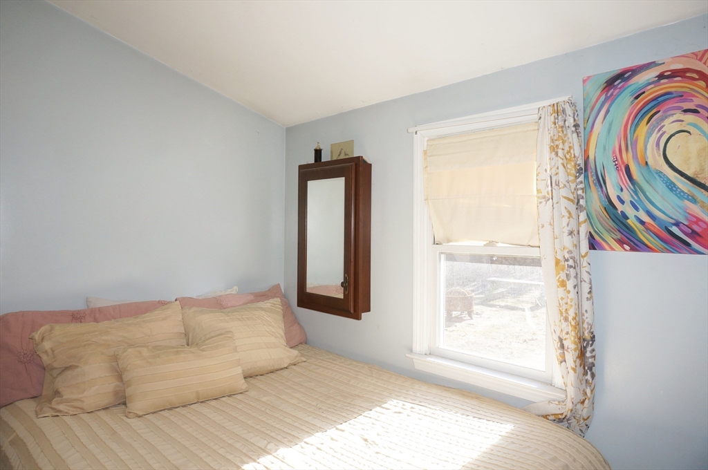 9 Circuit Road West Yarmouth, MA 02673 - Photo 15 of 23 a bedroom with a bed and a window