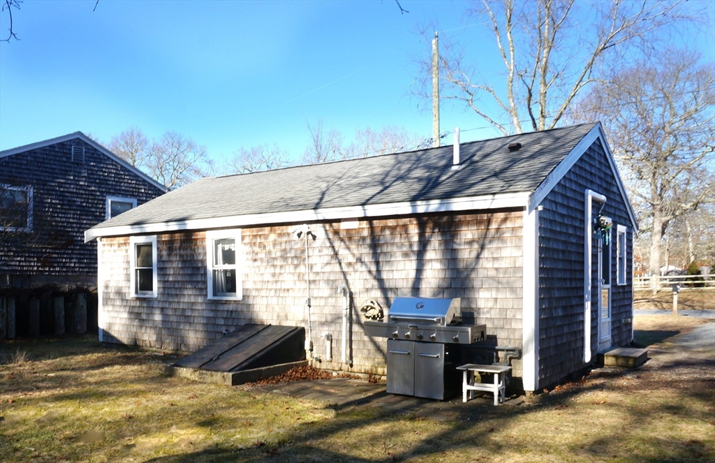9 Circuit Road West Yarmouth, MA 02673 - Photo 16 of 23 a view of a house with backyard porch and sitting area