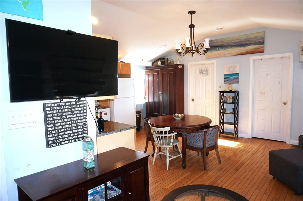 9 Circuit Road West Yarmouth, MA 02673 - Photo 3 of 23 a view of a dining room with furniture and wooden floor