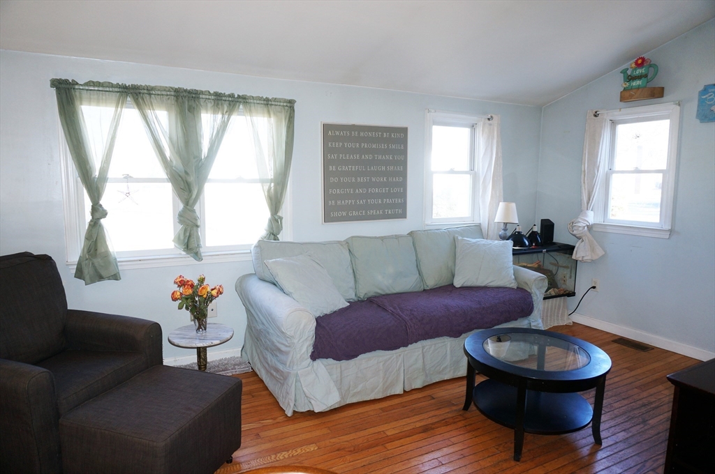 9 Circuit Road West Yarmouth, MA 02673 - Photo 4 of 23 a living room with furniture and a large window