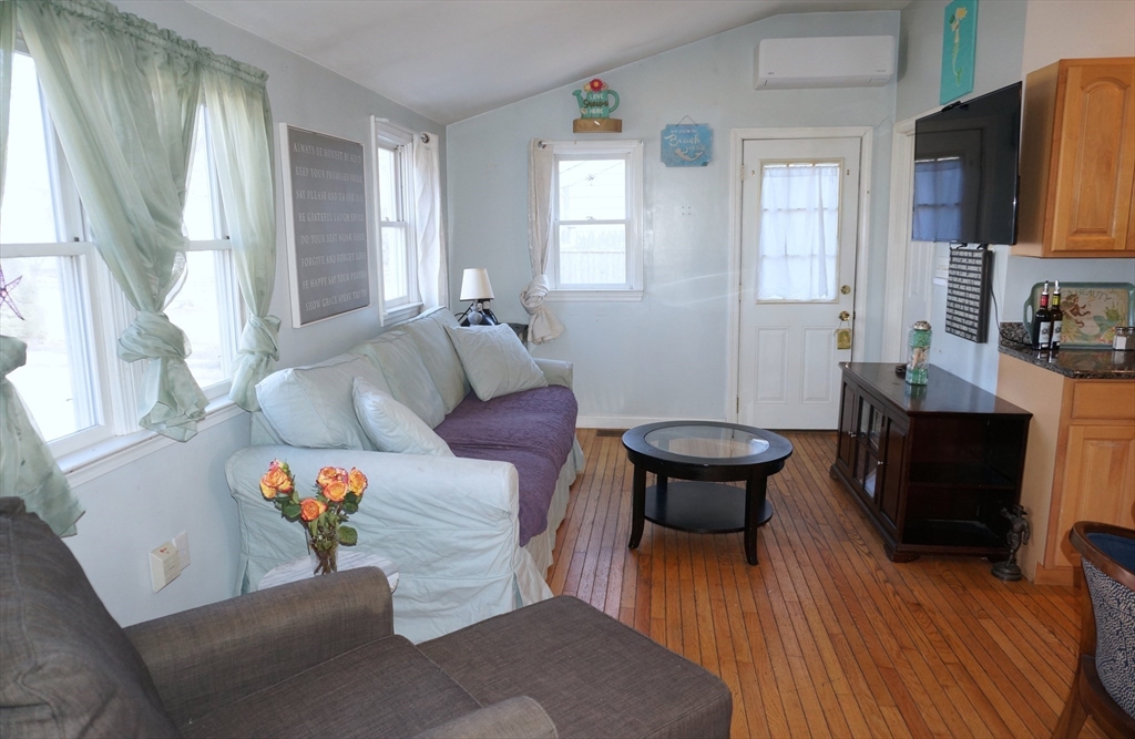 9 Circuit Road West Yarmouth, MA 02673 - Photo 5 of 23 a living room with furniture and a fireplace