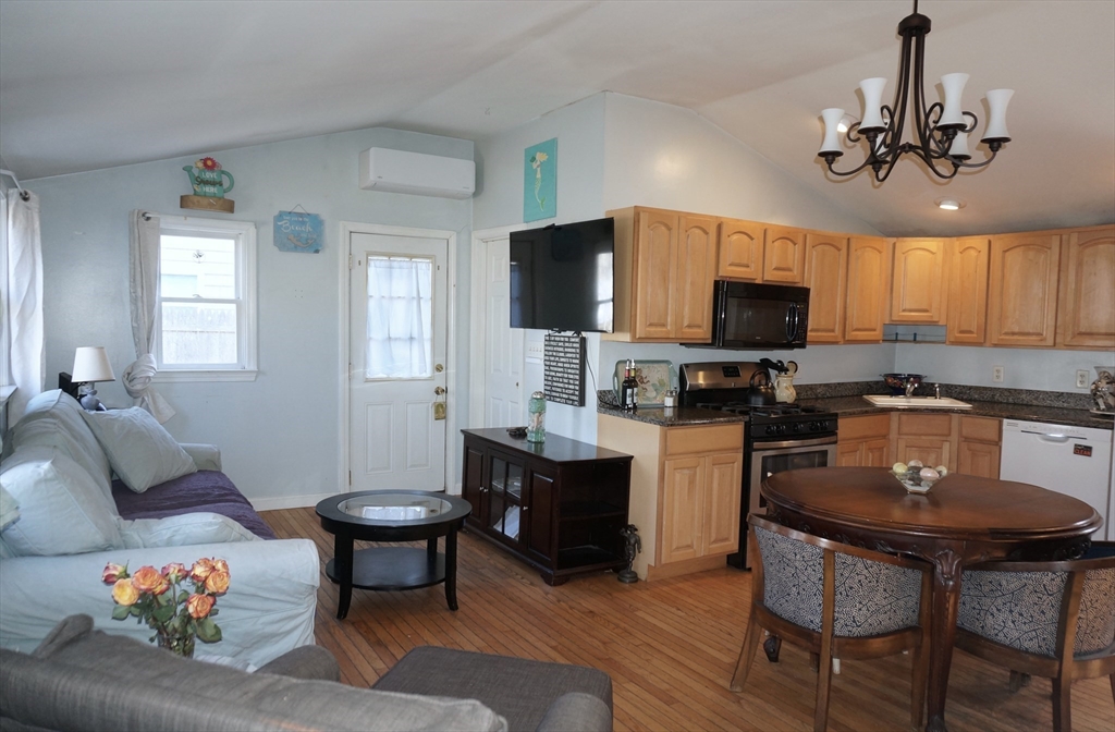 9 Circuit Road West Yarmouth, MA 02673 - Photo 6 of 23 a living room with furniture and a flat screen tv