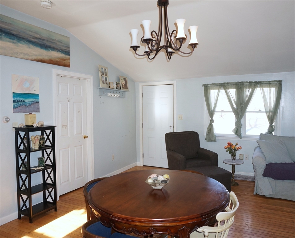 9 Circuit Road West Yarmouth, MA 02673 - Photo 8 of 23 a view of a dining room with furniture and wooden floor