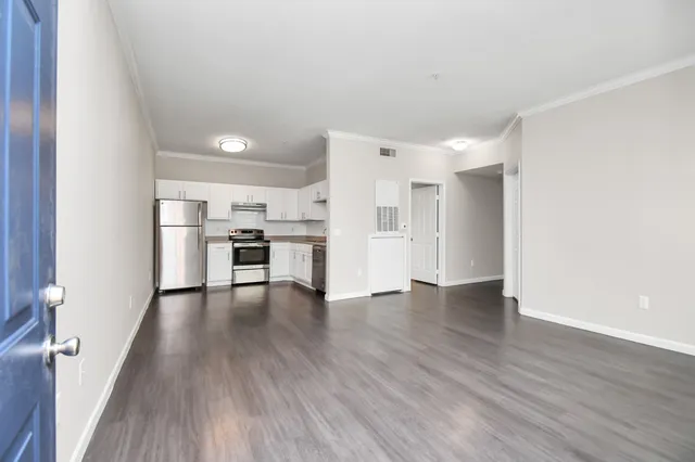 a view of kitchen with furniture and wooden floor