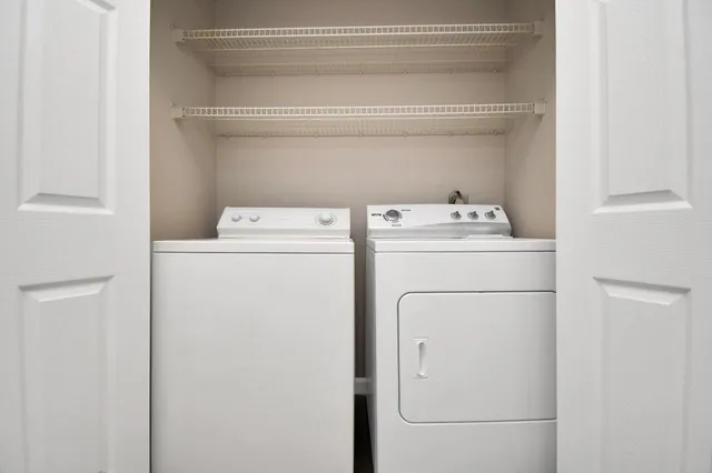 a utility room with dryer and washer
