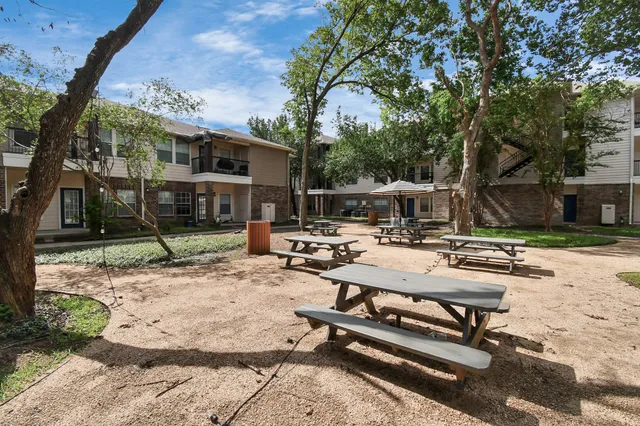 a view of backyard with sitting area
