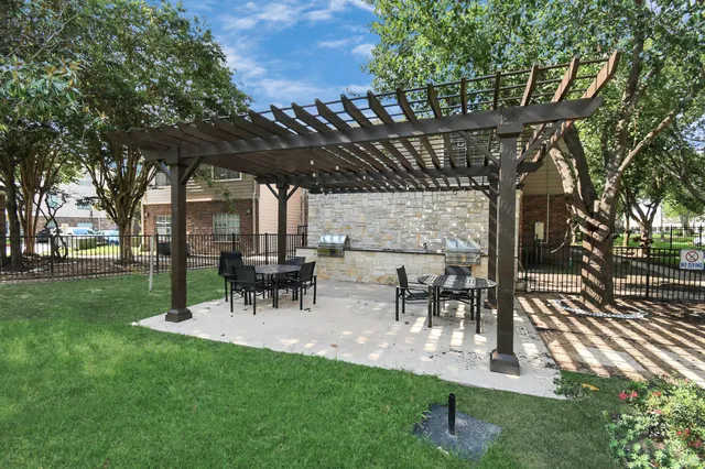 a view of a backyard with sitting area