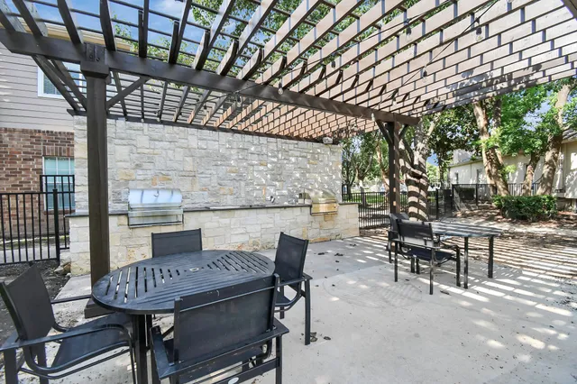 a view of a tables and chairs in a patio