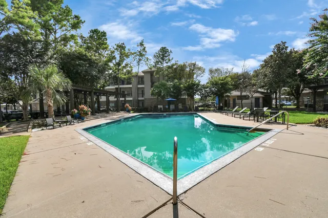 a view of a park with swings and slides