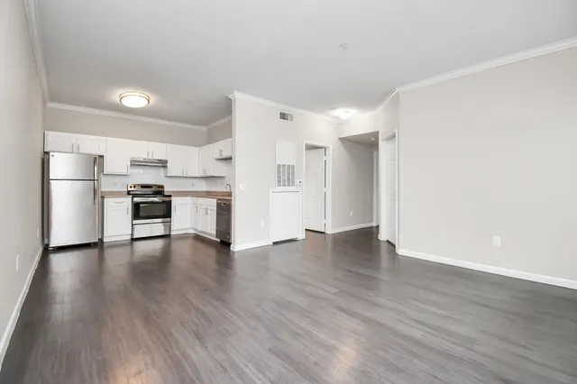a view of kitchen with stainless steel appliances refrigerator and microwave