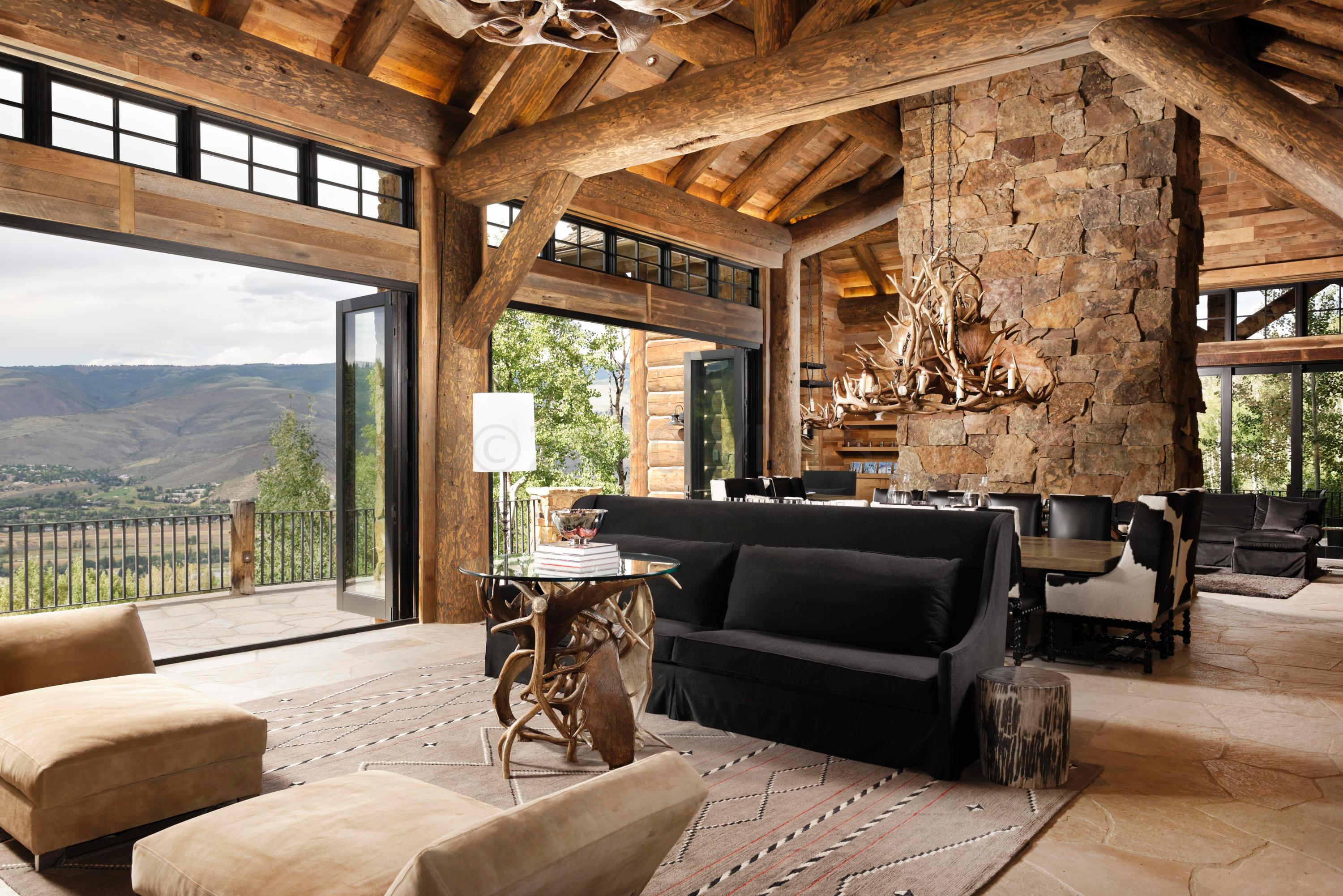 1580 Cresta Road Edwards, CO 81632 - Photo 3 of 25 a living room with furniture and a floor to ceiling window