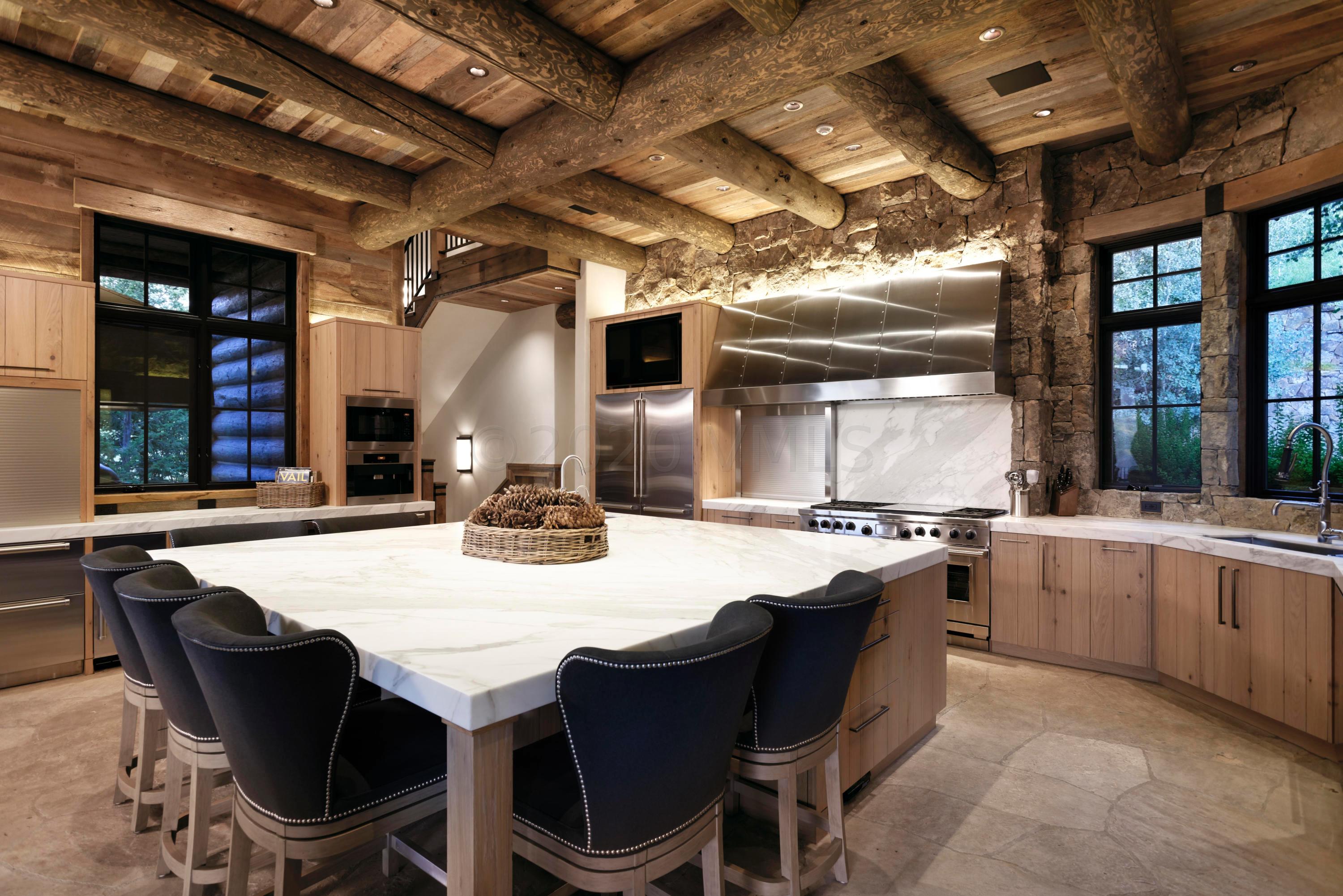 1580 Cresta Road Edwards, CO 81632 - Photo 4 of 25 a kitchen with stainless steel appliances granite countertop a stove and a refrigerator