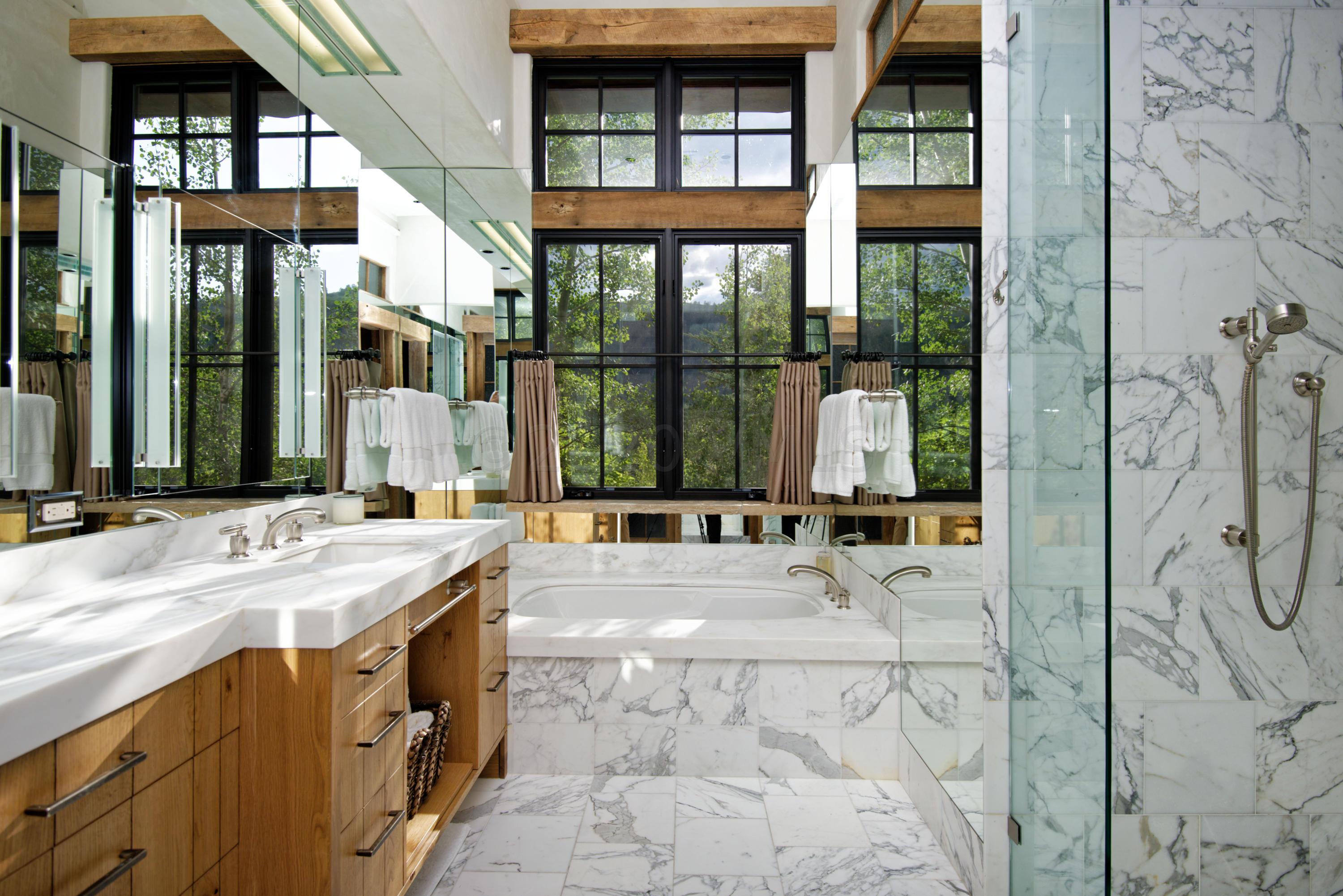 1580 Cresta Road Edwards, CO 81632 - Photo 7 of 25 a large bathroom with a tub and window