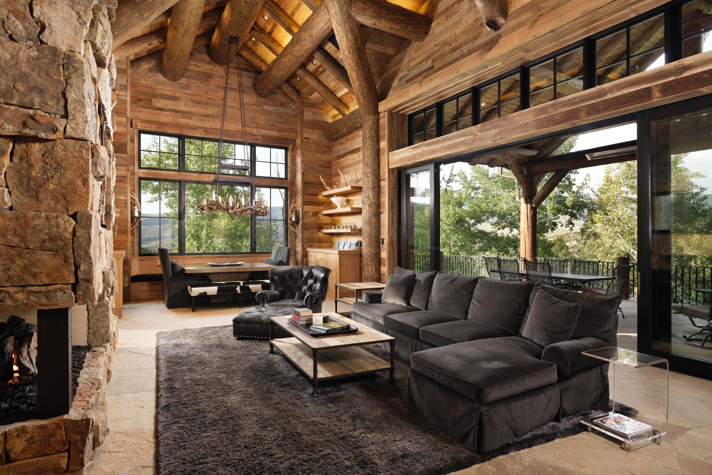 1580 Cresta Road Edwards, CO 81632 - Photo 9 of 25 a living room with furniture and a floor to ceiling window
