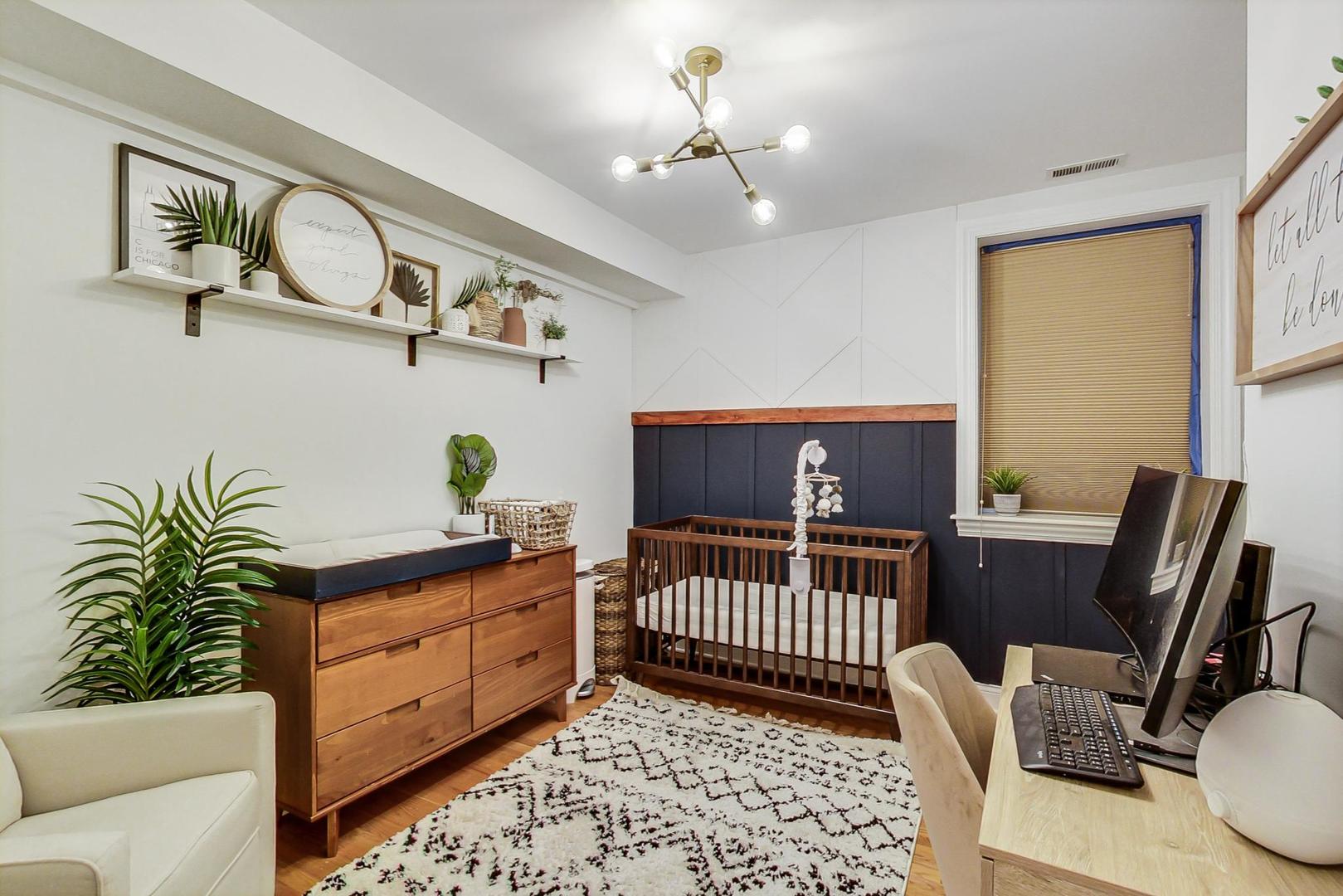 2142 West Addison Street, Unit 1A Chicago, IL 60618 - Photo 11 of 23 a bedroom with furniture and a window