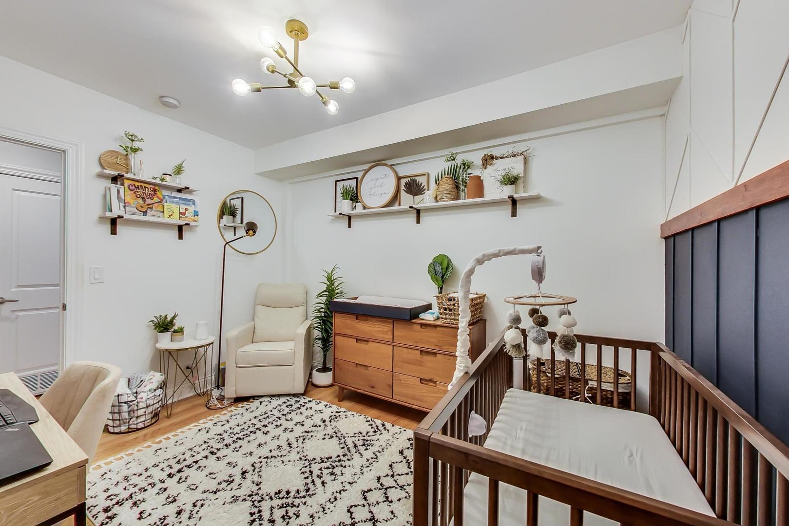 2142 West Addison Street, Unit 1A Chicago, IL 60618 - Photo 12 of 23 a bedroom with furniture and wooden floor