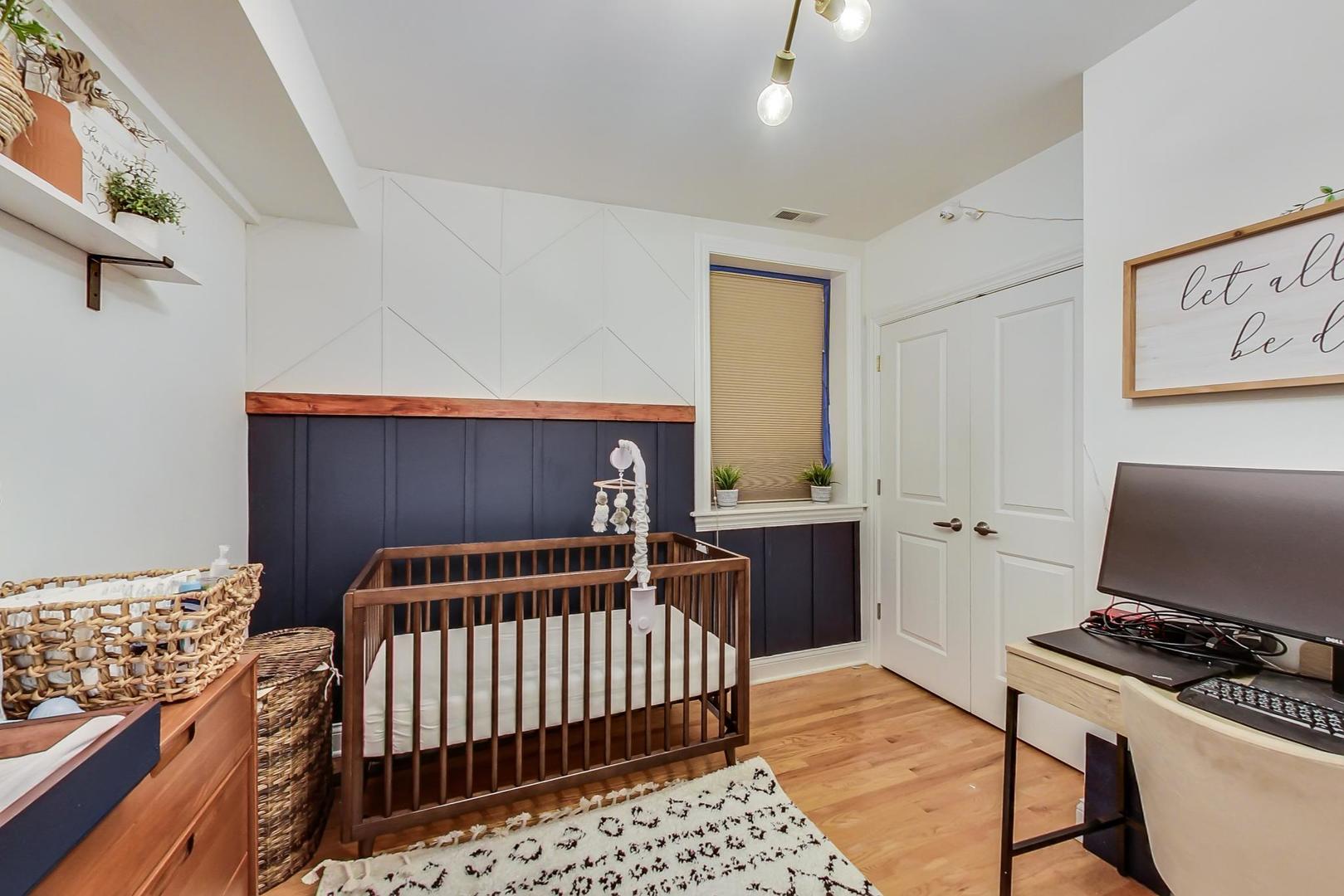 2142 West Addison Street, Unit 1A Chicago, IL 60618 - Photo 13 of 23 a bedroom with furniture and a window