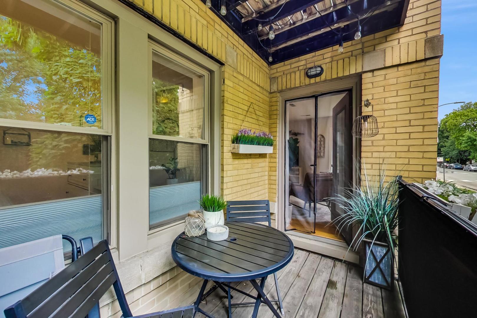 2142 West Addison Street, Unit 1A Chicago, IL 60618 - Photo 19 of 23 a view of a entryway door front of house