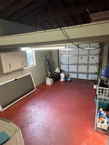 a view of room with window and air conditioner