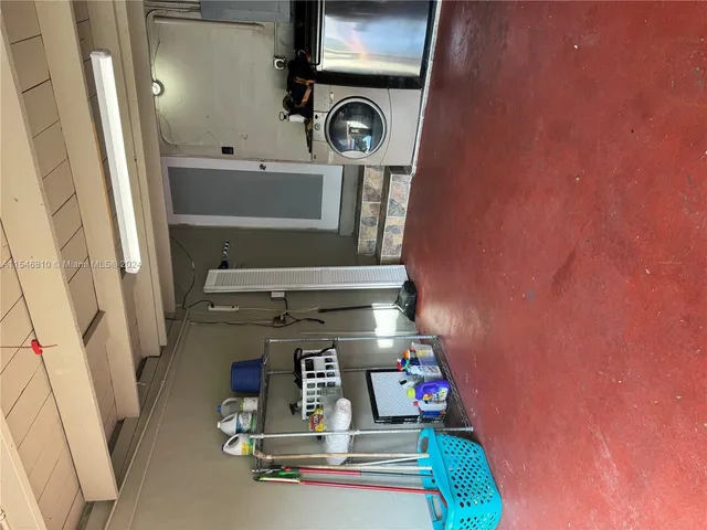 a room with a washing machine and a washing machine