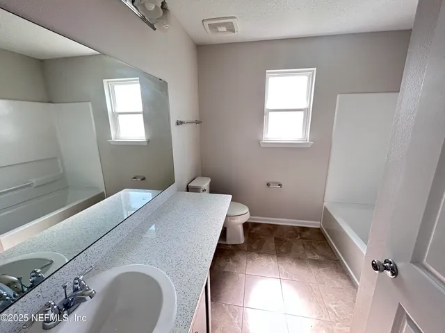 a bathroom with a sink and toilet