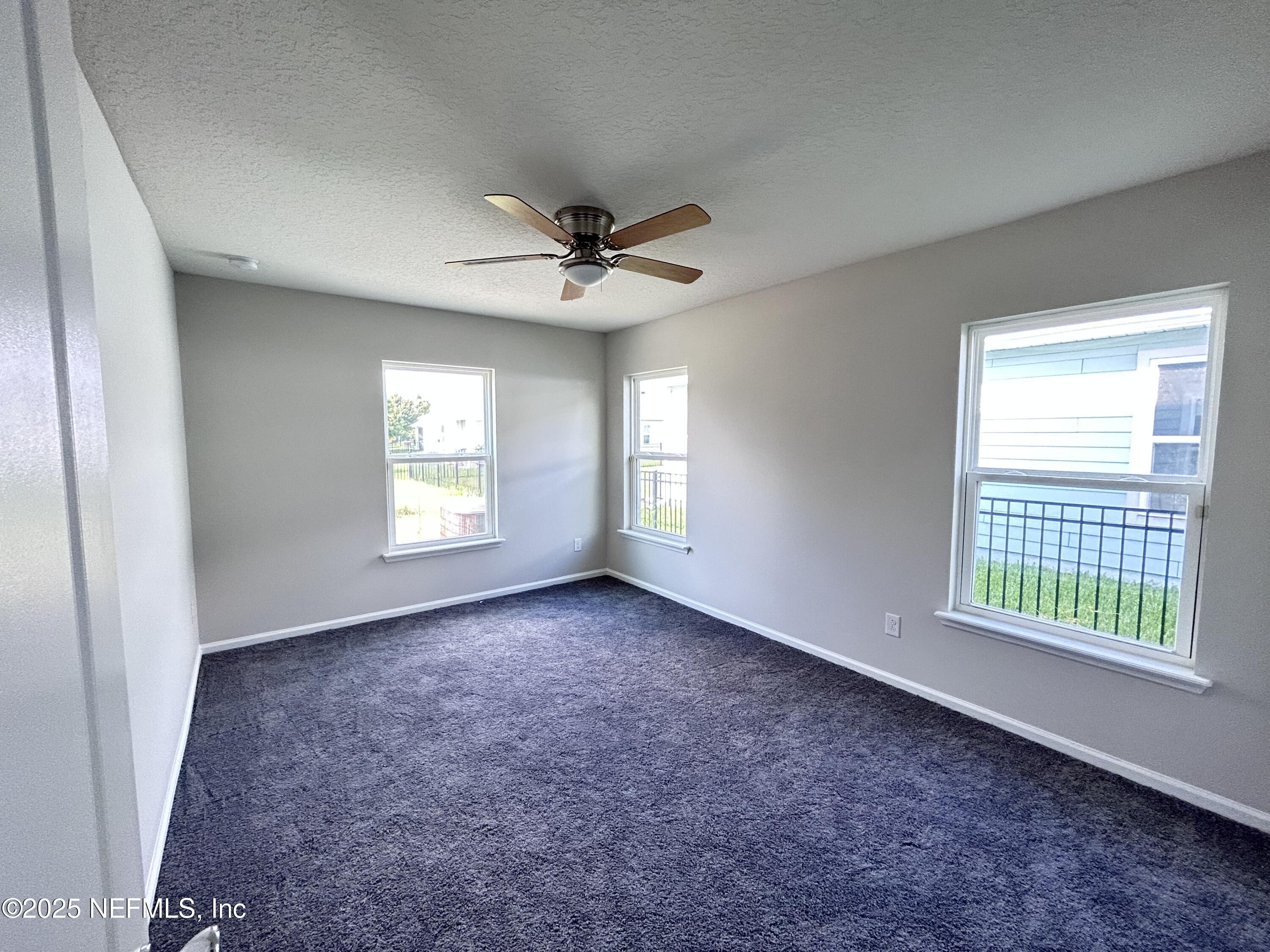 102 Bluejack Lane St. Augustine, FL 32095 - Photo 14 of 32 a view of an empty room with a window