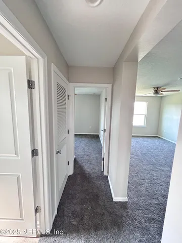 a bathroom with a double vanity sink mirror and toilet