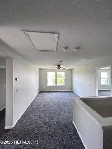 an empty room with a bathroom