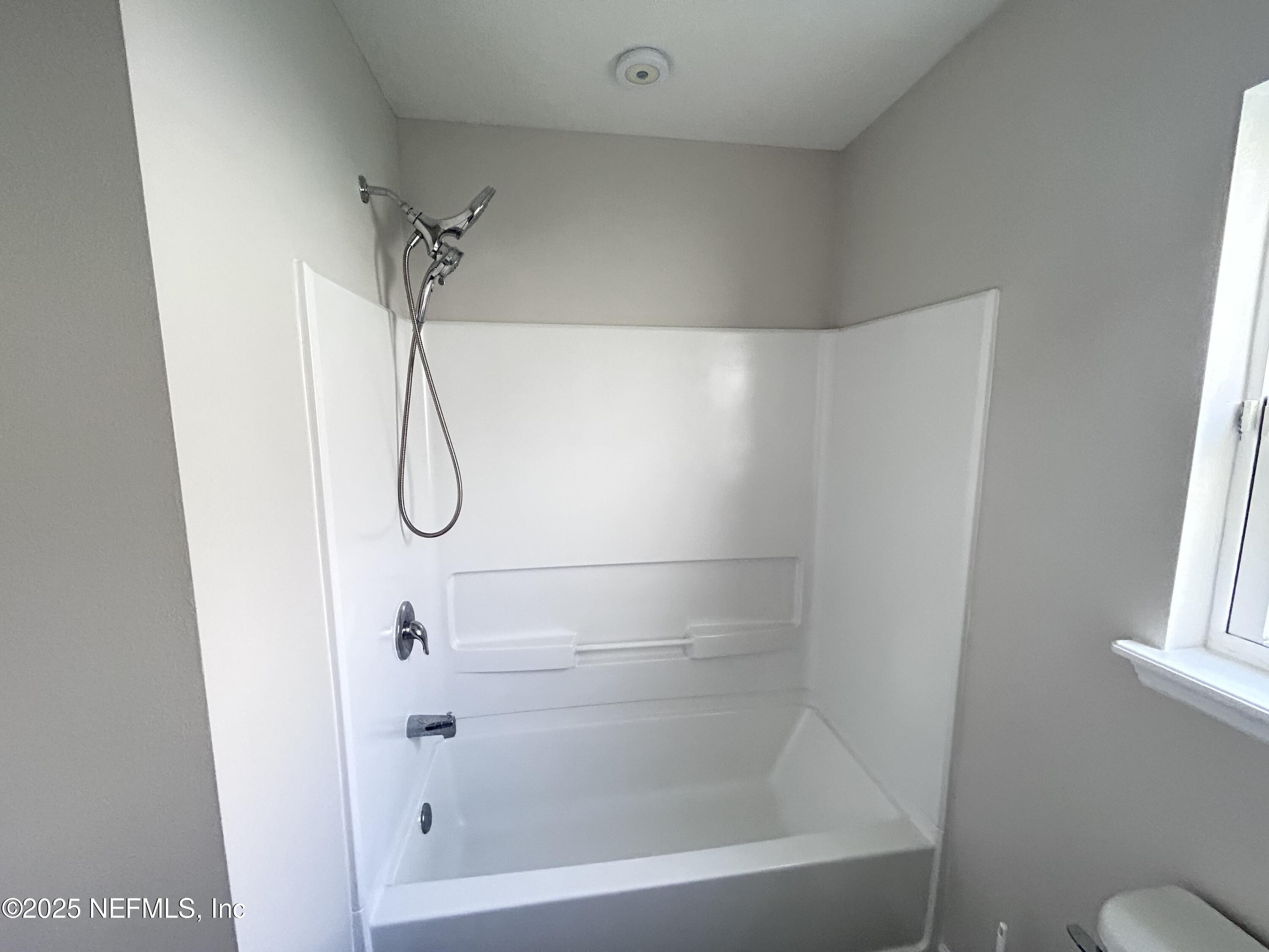 102 Bluejack Lane St. Augustine, FL 32095 - Photo 22 of 32 a bathroom with a bath tub and a shower