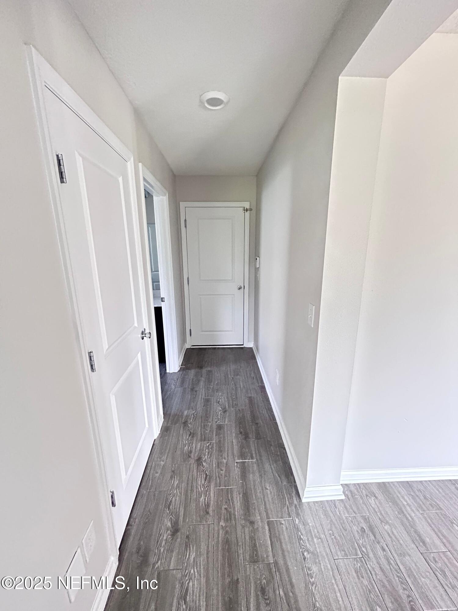 102 Bluejack Lane St. Augustine, FL 32095 - Photo 26 of 32 a view of a hallway with wooden floor