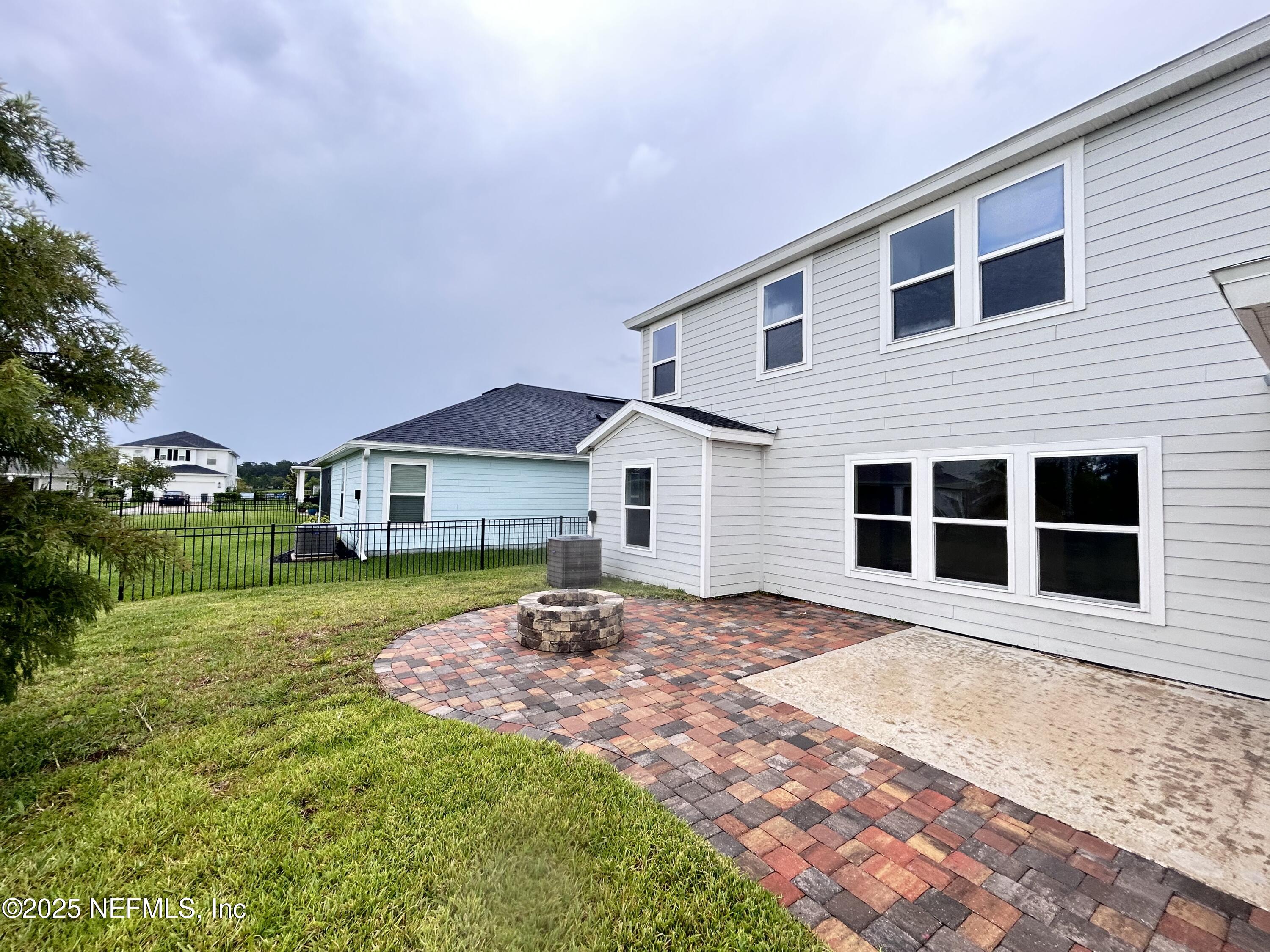 102 Bluejack Lane St. Augustine, FL 32095 - Photo 4 of 32 a front view of a house with a yard