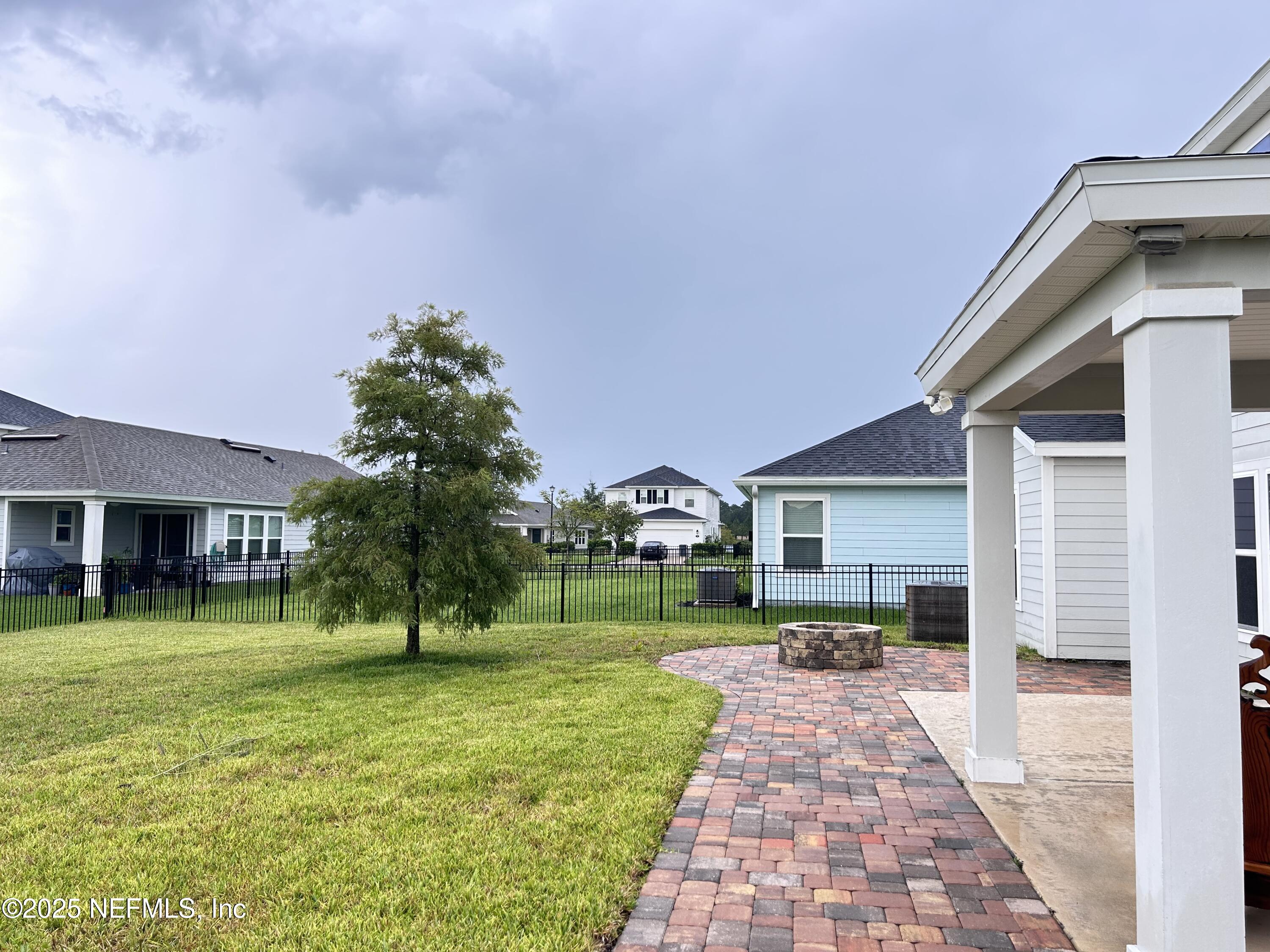 102 Bluejack Lane St. Augustine, FL 32095 - Photo 5 of 32 a front view of a house with a yard