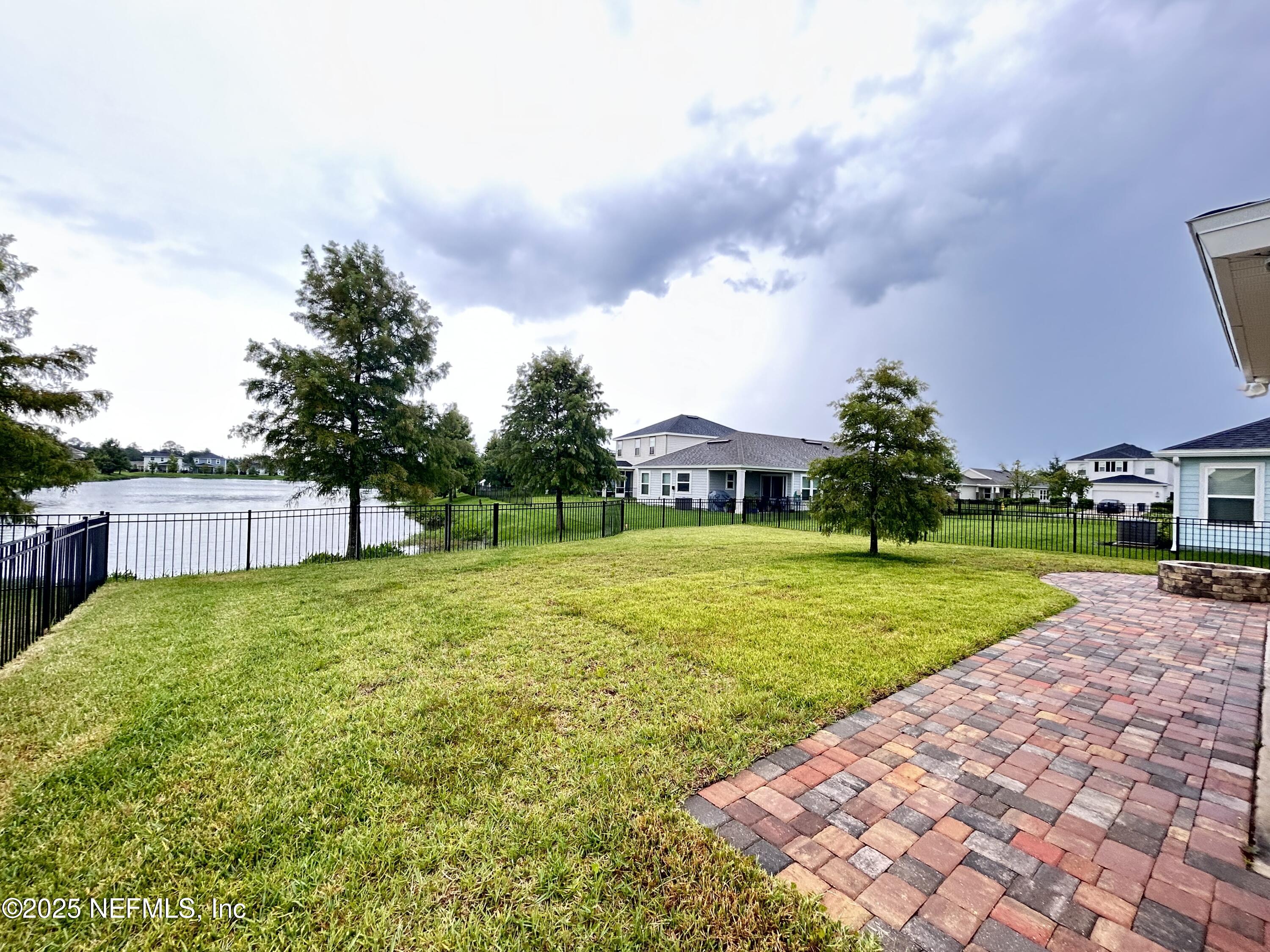 102 Bluejack Lane St. Augustine, FL 32095 - Photo 6 of 32 a view of backyard with swimming pool and green space