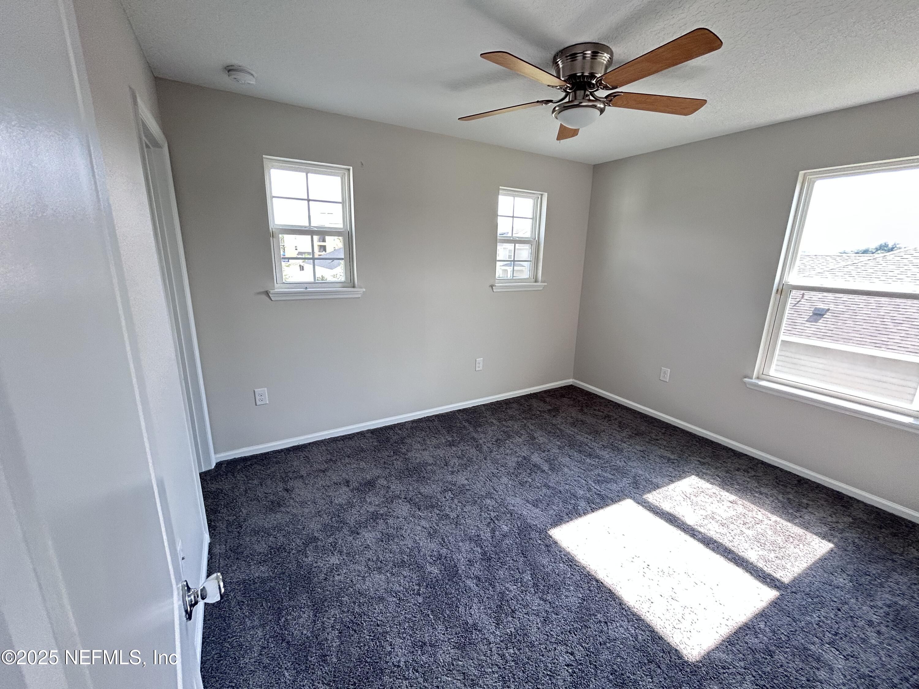 102 Bluejack Lane St. Augustine, FL 32095 - Photo 10 of 32 a view of an empty room and window