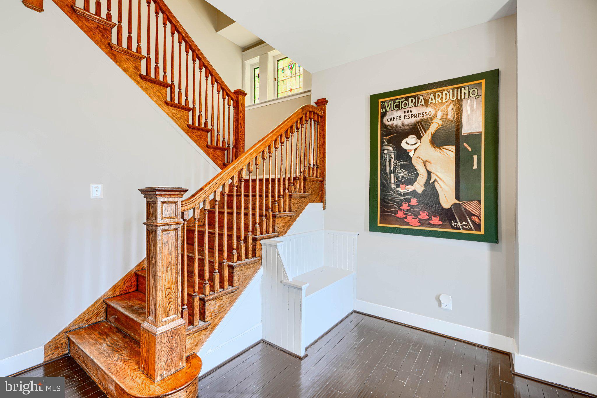 3414 Alto Road, Unit 2 Baltimore, MD 21216 - Photo 4 of 26 Elegant staircase with vintage art.