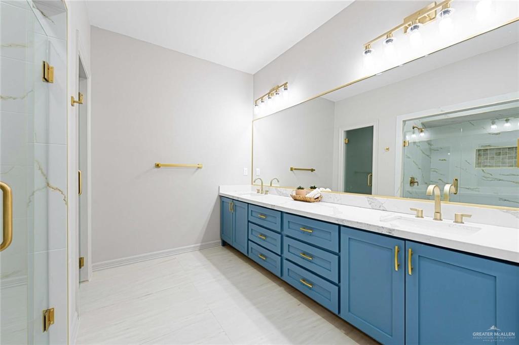 2216 South 45th Street McAllen, TX 78503 - Photo 17 of 34 a bathroom with a double vanity sink mirror and double